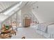 A bright bedroom with large windows, vaulted ceilings, and stylish decor at 10729 Trego Trl, Raleigh, NC 27614