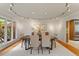 Bright dining room featuring hardwood floors, track lighting, and natural light from a large bay window at 10729 Trego Trl, Raleigh, NC 27614