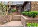 Elegant front entrance featuring brick steps and lush greenery at 10729 Trego Trl, Raleigh, NC 27614