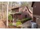 Charming two-story home surrounded by mature trees and lush landscaping at 10729 Trego Trl, Raleigh, NC 27614