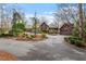 Charming home with mature trees and a circular driveway with a detached garage at 10729 Trego Trl, Raleigh, NC 27614