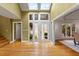 Bright and airy foyer featuring hardwood floors and skylights at 10729 Trego Trl, Raleigh, NC 27614