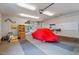 Organized garage featuring space for car storage and projects at 10729 Trego Trl, Raleigh, NC 27614
