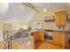 Updated kitchen with granite countertops, an island with seating, and modern appliances at 10729 Trego Trl, Raleigh, NC 27614