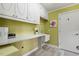 Functional laundry room with ample counter space and built-in cabinets at 10729 Trego Trl, Raleigh, NC 27614