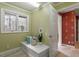 Cozy laundry room with a window, ample counter space, and neutral decor at 10729 Trego Trl, Raleigh, NC 27614