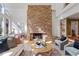 Cozy living room features a stone fireplace, hardwood floors, and comfortable seating, creating a relaxing atmosphere at 10729 Trego Trl, Raleigh, NC 27614