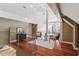 Bright loft area featuring hardwood floors, a modern railing, and stylish seating at 10729 Trego Trl, Raleigh, NC 27614