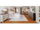 Spacious main bedroom with hardwood floors, large windows, and elegant furnishings at 10729 Trego Trl, Raleigh, NC 27614