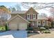 Charming two-story home features a two-car garage and well-manicured landscaping at 109 Covington Square Dr, Cary, NC 27513