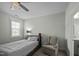 Bedroom features a single bed, side chair, and ample natural light at 110 Jacoby Way, Chapel Hill, NC 27516