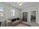 Bedroom features a cozy couch, window, and neutral decor at 110 Jacoby Way, Chapel Hill, NC 27516