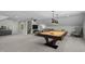 Spacious game room with a pool table, wet bar, and lounge area at 110 Jacoby Way, Chapel Hill, NC 27516