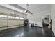 Clean, spacious garage with ample storage, featuring a dark epoxy floor and bright, natural lighting at 110 Jacoby Way, Chapel Hill, NC 27516