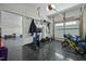Organized garage featuring fitness equipment, including a stationary bike, and storage solutions for a variety of gear at 110 Jacoby Way, Chapel Hill, NC 27516