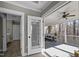Hallway offering doorway access to a bathroom and the outdoor screened in patio at 110 Jacoby Way, Chapel Hill, NC 27516