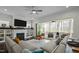 Inviting living room featuring a fireplace and seamless access to the screened-in porch with outdoor seating at 110 Jacoby Way, Chapel Hill, NC 27516