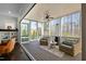 Cozy screened-in porch with wicker seating and a ceiling fan provides a perfect spot for outdoor relaxation at 110 Jacoby Way, Chapel Hill, NC 27516