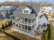 Beautiful home featuring a screened-in back porch, second-story deck and patio area at 110 Jacoby Way, Chapel Hill, NC 27516