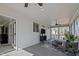 Relaxing sunroom features tongue and groove ceiling, ceiling fan, and scenic views at 110 Jacoby Way, Chapel Hill, NC 27516
