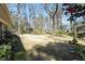 Expansive, well-maintained backyard with mature trees and lush greenery, perfect for outdoor activities at 112 Celeste Cir, Chapel Hill, NC 27517