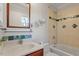 Bathroom featuring tile accents, vanity, mirror, and tub with shower at 112 Celeste Cir, Chapel Hill, NC 27517