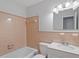 Neat bathroom featuring a tiled tub/shower, updated vanity, and well-maintained fixtures at 112 Celeste Cir, Chapel Hill, NC 27517