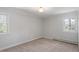 Bedroom with light carpet, a window, and neutral paint at 112 Celeste Cir, Chapel Hill, NC 27517
