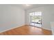 Dining room with hardwood floors featuring a glass sliding door leading to a sunroom at 112 Celeste Cir, Chapel Hill, NC 27517