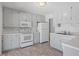 Classic kitchen with white cabinets, stainless steel appliances, and tile backsplash at 112 Celeste Cir, Chapel Hill, NC 27517