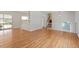 Open concept living room featuring hardwood floors, stairs, and natural light at 112 Celeste Cir, Chapel Hill, NC 27517