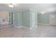 Bright living room with white marble flooring, modern fixtures, and neutral paint at 112 Celeste Cir, Chapel Hill, NC 27517