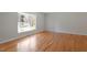 Spacious living room featuring hardwood floors and a large window at 112 Celeste Cir, Chapel Hill, NC 27517