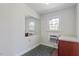 Small office area features a large mirror and a window bringing in natural light at 112 Celeste Cir, Chapel Hill, NC 27517