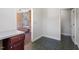 Open doorway to the sunroom from the office space shows the brick flooring and exposed brick wall at 112 Celeste Cir, Chapel Hill, NC 27517