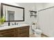 Bathroom featuring a single sink vanity with modern fixtures, a mirror, and a shower with a curtain at 117 Oak Rise Ln, Fuquay Varina, NC 27526