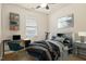 Well-lit bedroom featuring stylish decor, a desk, and a comfortable bed with a blue color scheme at 117 Oak Rise Ln, Fuquay Varina, NC 27526