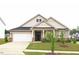 Charming single-Gathering home with a well-maintained lawn and attached two-car garage at 117 Oak Rise Ln, Fuquay Varina, NC 27526