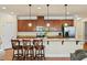 Spacious kitchen island with seating and stainless steel appliances at 117 Oak Rise Ln, Fuquay Varina, NC 27526