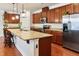 Modern kitchen featuring an island with granite countertops and stainless steel appliances at 117 Oak Rise Ln, Fuquay Varina, NC 27526
