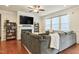 Cozy living room with fireplace, built-in bookshelves, hardwood floors, and comfortable seating at 117 Oak Rise Ln, Fuquay Varina, NC 27526