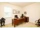 Traditional home office with wooden desk, chair, and natural light from window at 117 Oak Rise Ln, Fuquay Varina, NC 27526