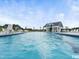 Community pool featuring plenty of lounge chairs and a covered seating area at 117 Oak Rise Ln, Fuquay Varina, NC 27526