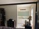 View into the bathroom area with vanity and updated lighting at 12 Patriot Cir, Durham, NC 27704