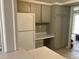 Kitchen featuring gray cabinets, white countertops, and a white refrigerator at 12 Patriot Cir, Durham, NC 27704