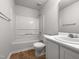 Clean bathroom featuring a white vanity, sink, toilet, and bathtub with a shower at 1213 Cotten Farm Dr, Fuquay Varina, NC 27526