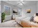 Bright bedroom featuring two large windows, neutral walls, and comfortable contemporary furnishings at 1213 Cotten Farm Dr, Fuquay Varina, NC 27526