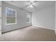 A carpeted bedroom offers bright natural light and spacious floors at 1213 Cotten Farm Dr, Fuquay Varina, NC 27526