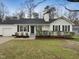 Charming single-story home with a well-manicured lawn and inviting curb appeal at 1213 Cotten Farm Dr, Fuquay Varina, NC 27526
