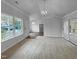 An open living room area with a view to the kitchen and natural light at 1213 Cotten Farm Dr, Fuquay Varina, NC 27526